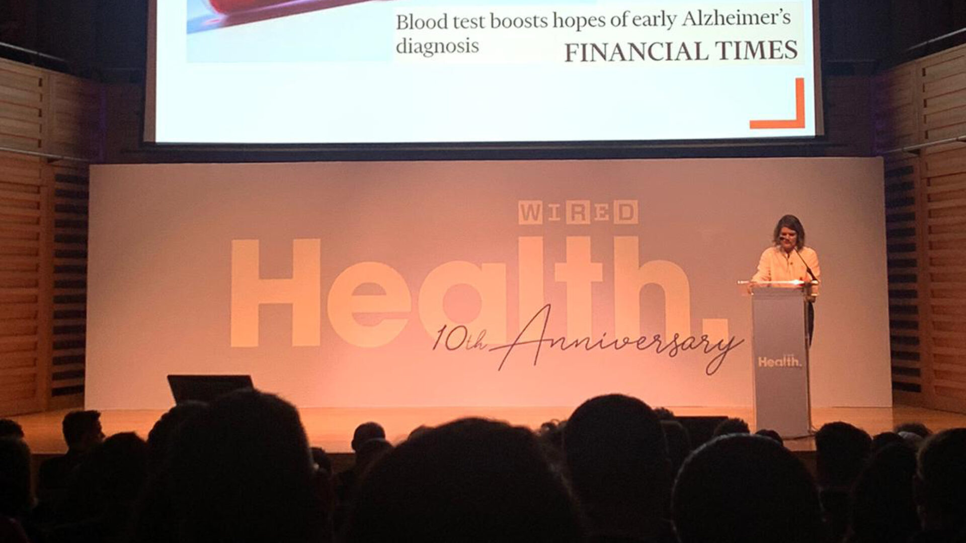 Shot of stage with 'WIRED Health 10th anniversary' on a poster in the background.